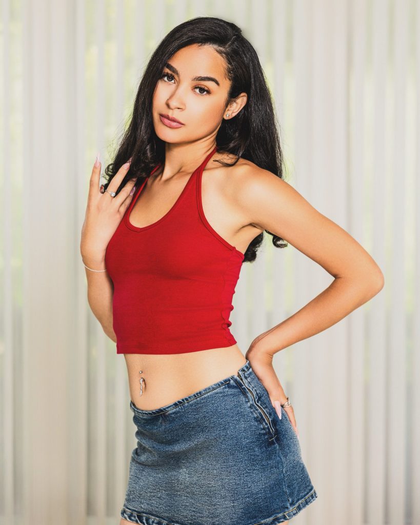 Nakisha Marin, Tone Talent Agency model, studio portrait in red halter
